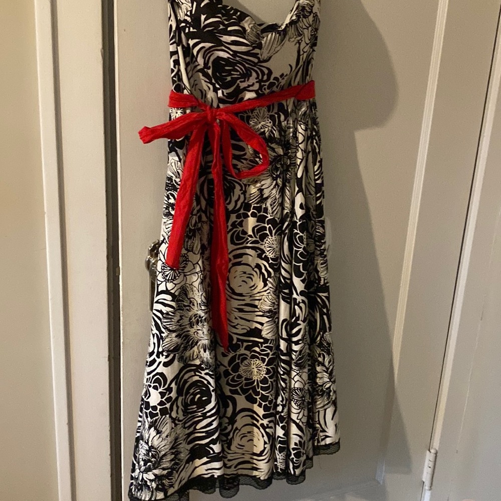 Strapless black and white floral dress with red tie